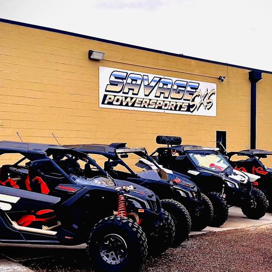 Side-by-sides outside the Savage Powersports shop in Pueblo